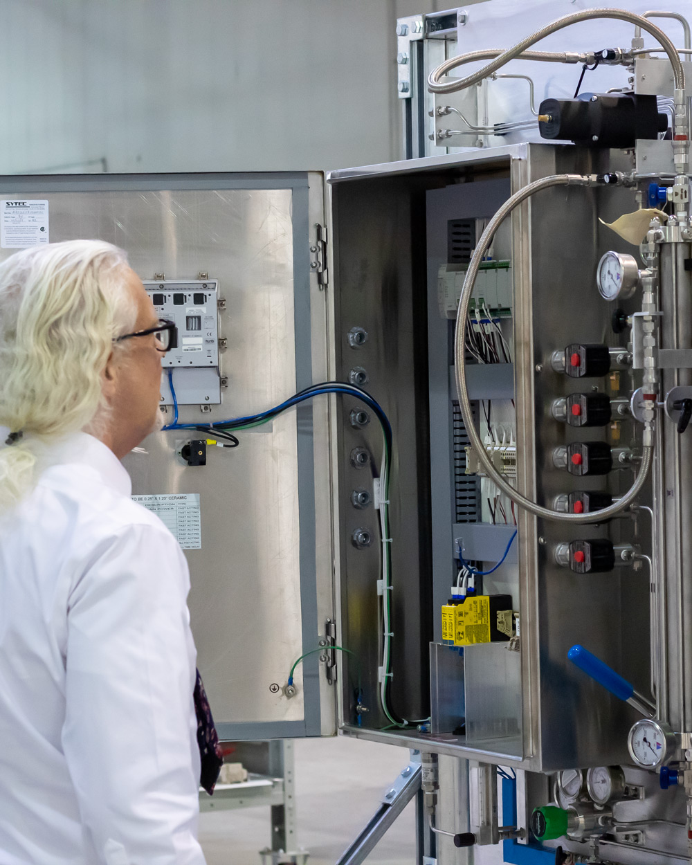 Process analyzer integration panel being inspected at Insight Analytical Solutions in Calgary
